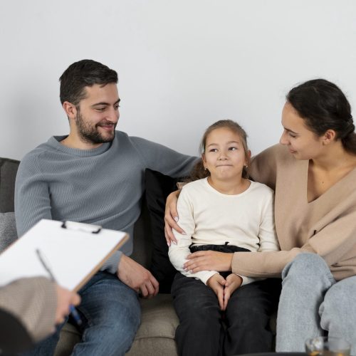 close-up-girl-therapy-session-with-parents