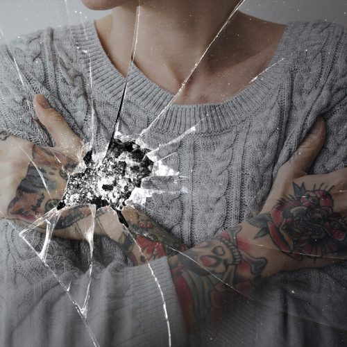 Cracked glass effect with depressed woman background